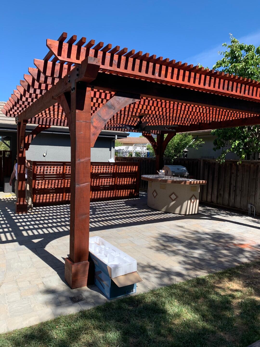 Open slat redwood pergola over patio - Cut Once Construction