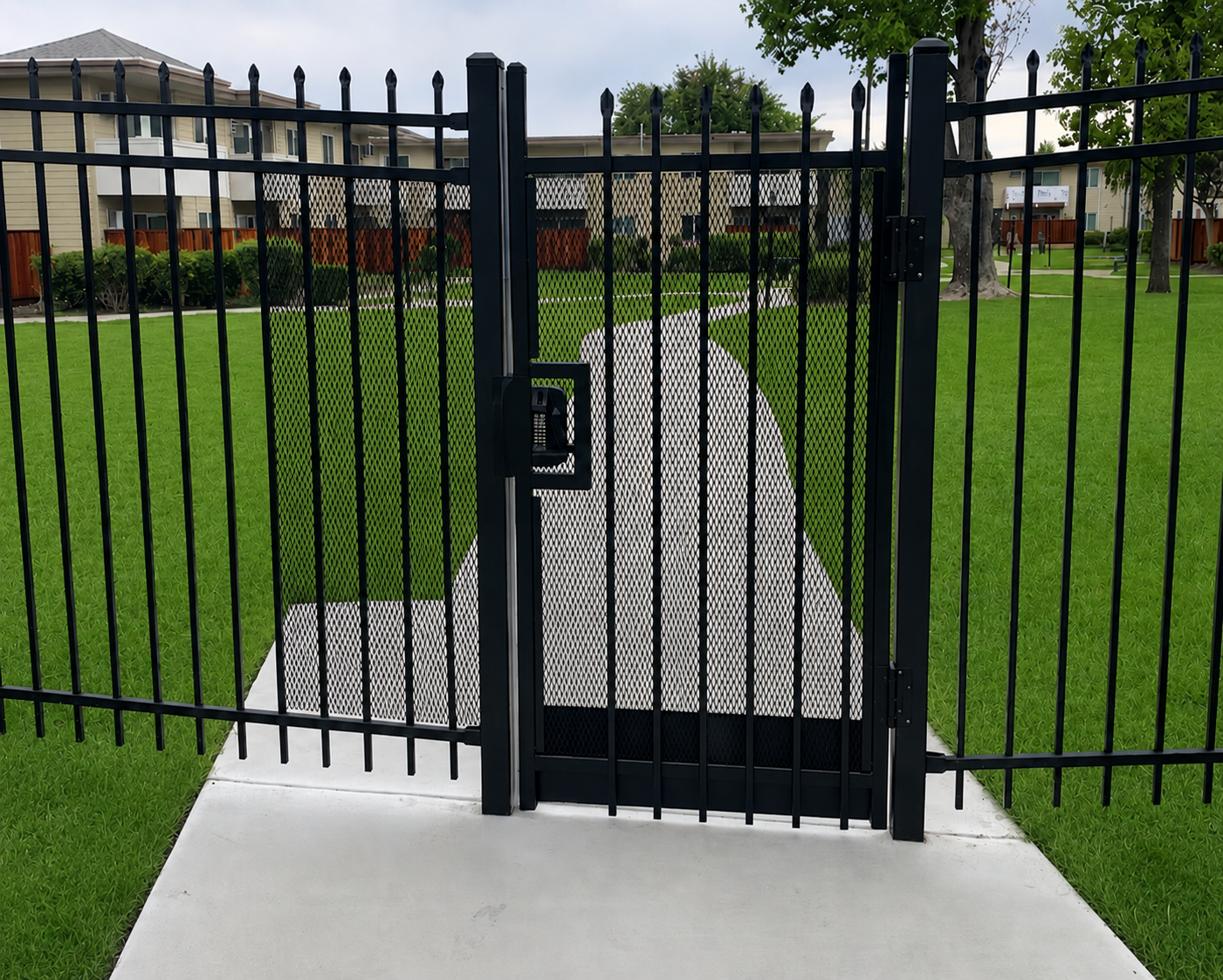 Black steel pedestrian access gate with keypad hardware at a multifamily property in Stockton, CA.